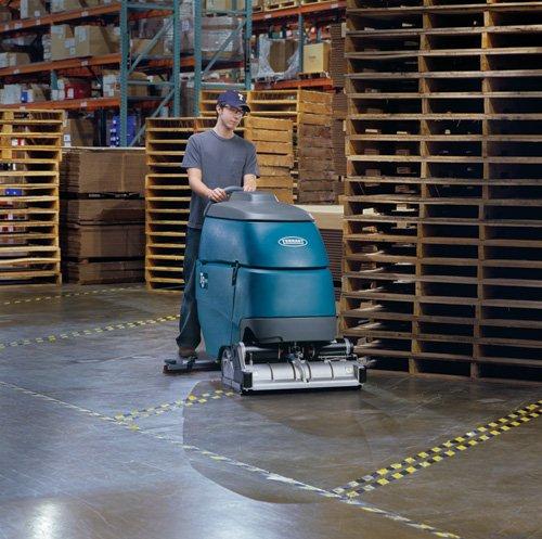 A Man cleaning a floor